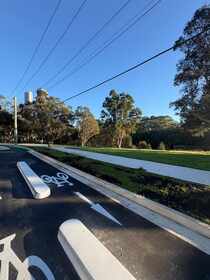 Cycleway edging with garden bed and concrete path finish